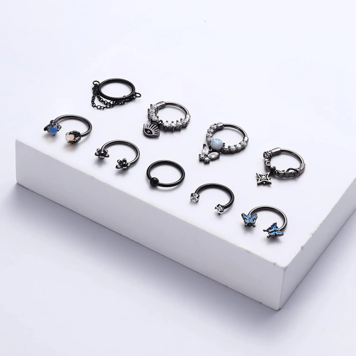 JOERICA 9pc 16G Septum Rings - Small, Dangle & Hoops with Cute, Evil Eye, Butterfly & Flower Designs - Surgical Steel Septum Piercing Jewelry